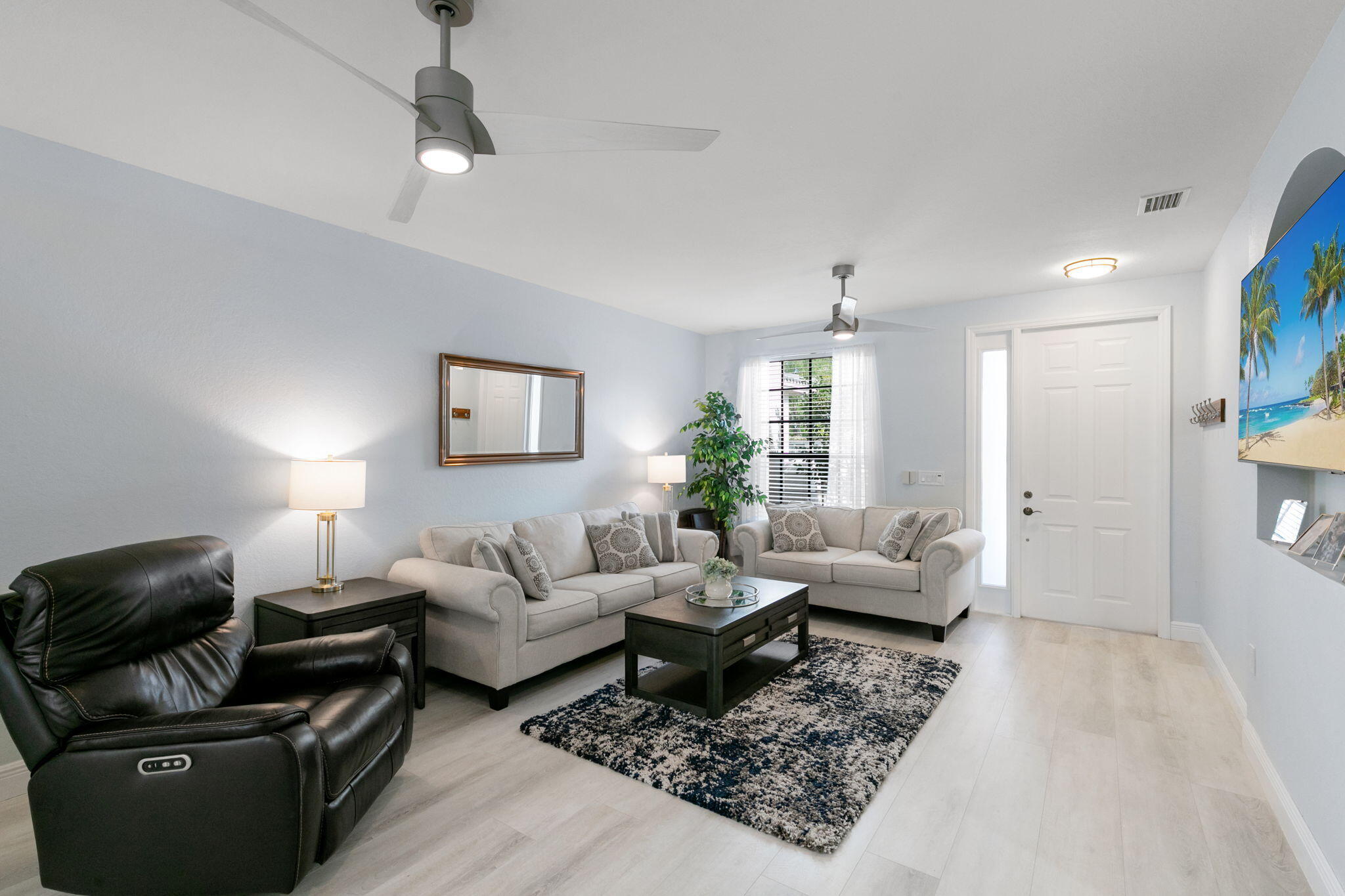 15068 Summit Pl Circle Naples, FL 34119 - Photo 2 of 29 a living room with furniture and a rug