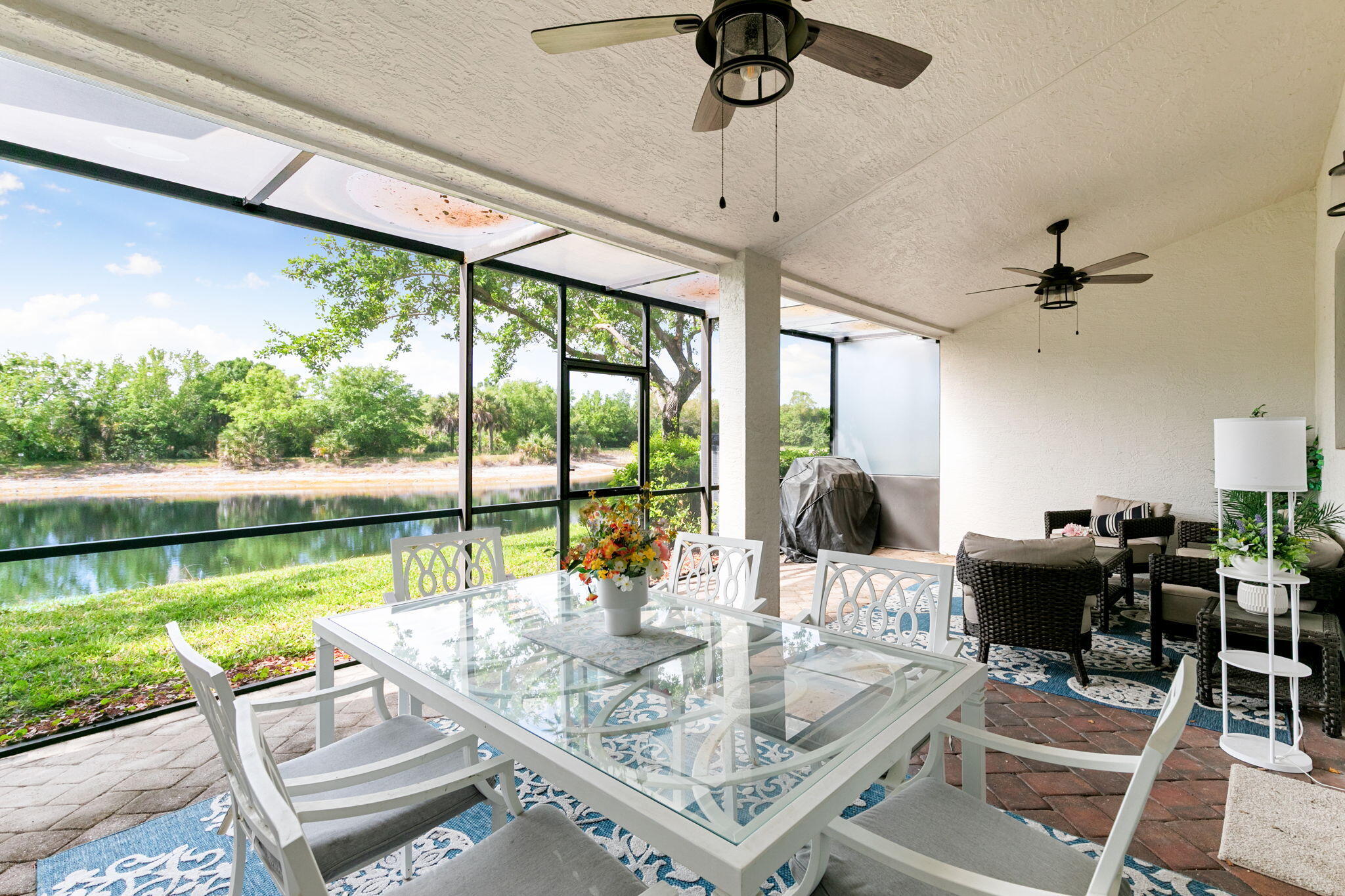 15068 Summit Pl Circle Naples, FL 34119 - Photo 21 of 29 a view of a dining room with furniture window and outside view