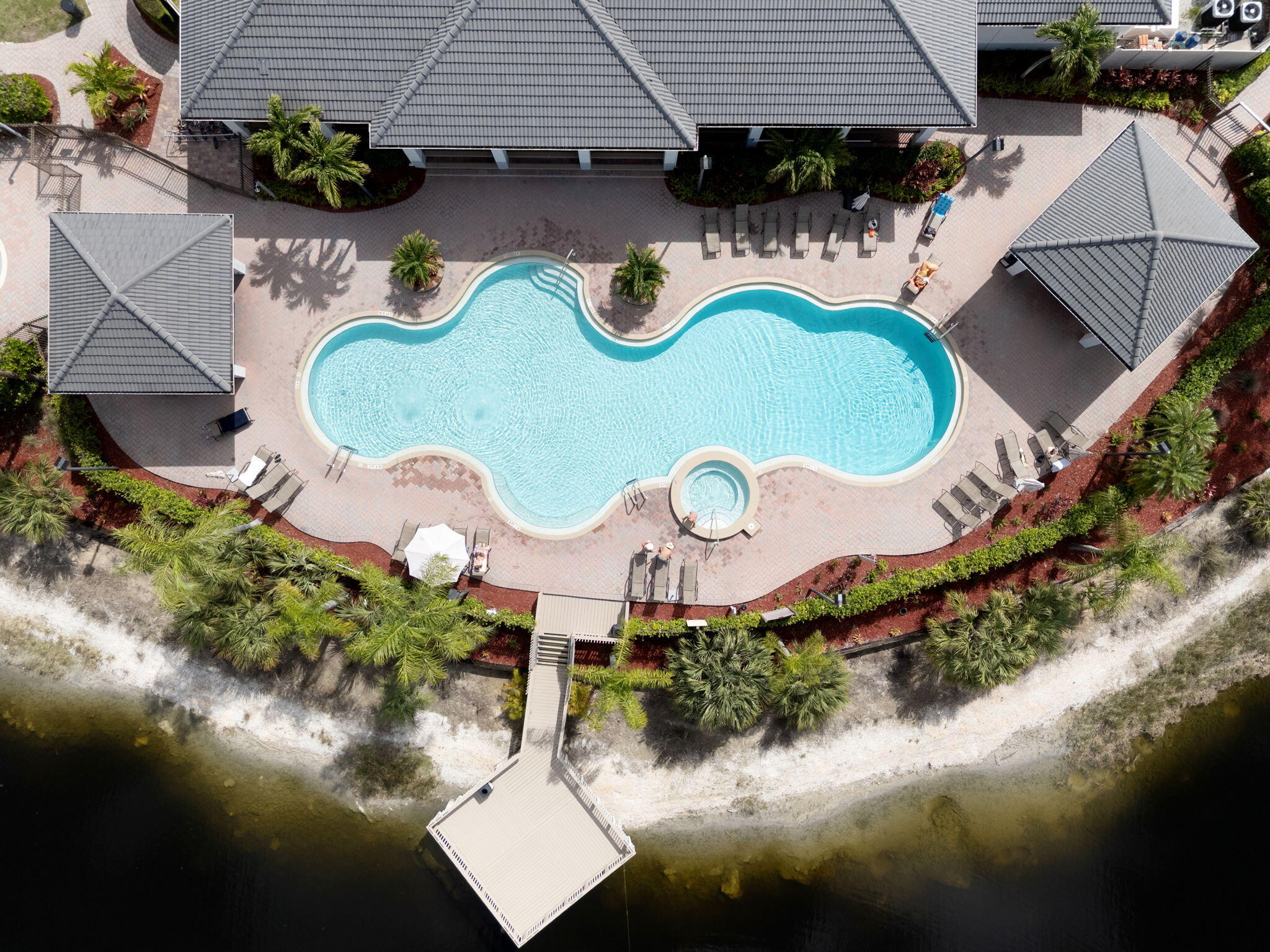 15068 Summit Pl Circle Naples, FL 34119 - Photo 23 of 29 an aerial view of a house with swimming pool and outdoor seating