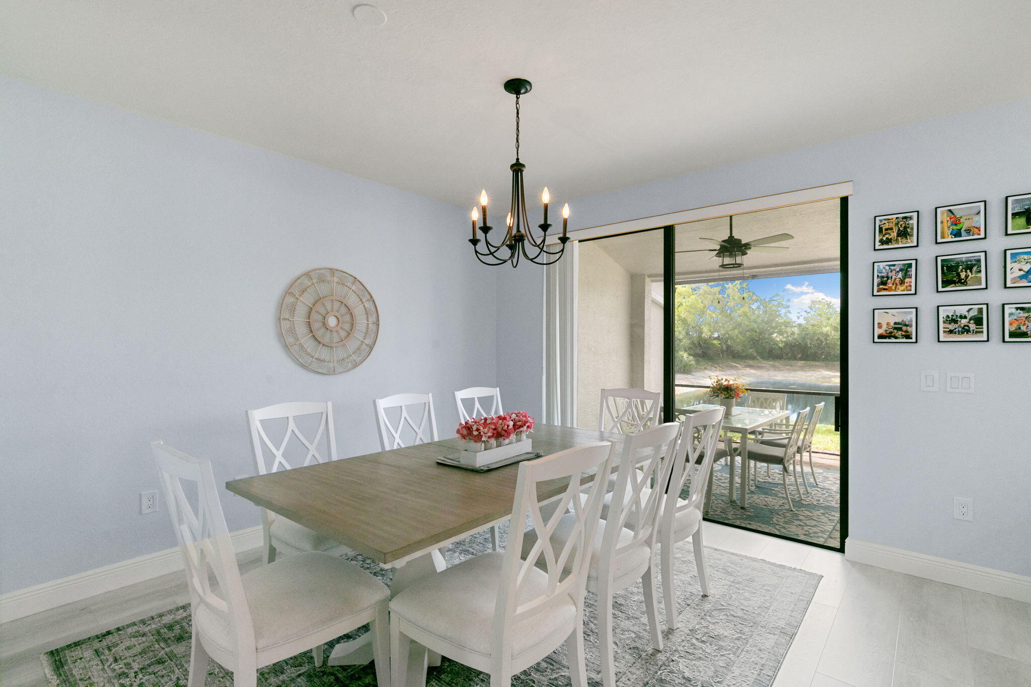 15068 Summit Pl Circle Naples, FL 34119 - Photo 10 of 29 a view of a dining room with furniture window and outside view
