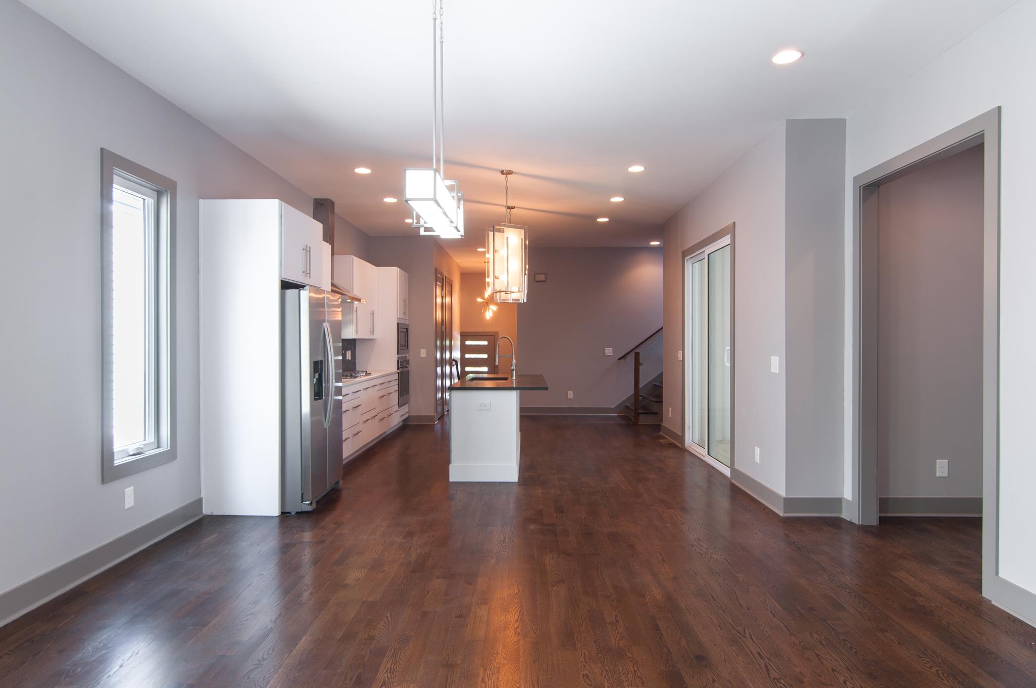 904 B Riverside Drive Nashville, TN 37206 - Photo 11 of 30 a view of a hallway with wooden floor and a kitchen