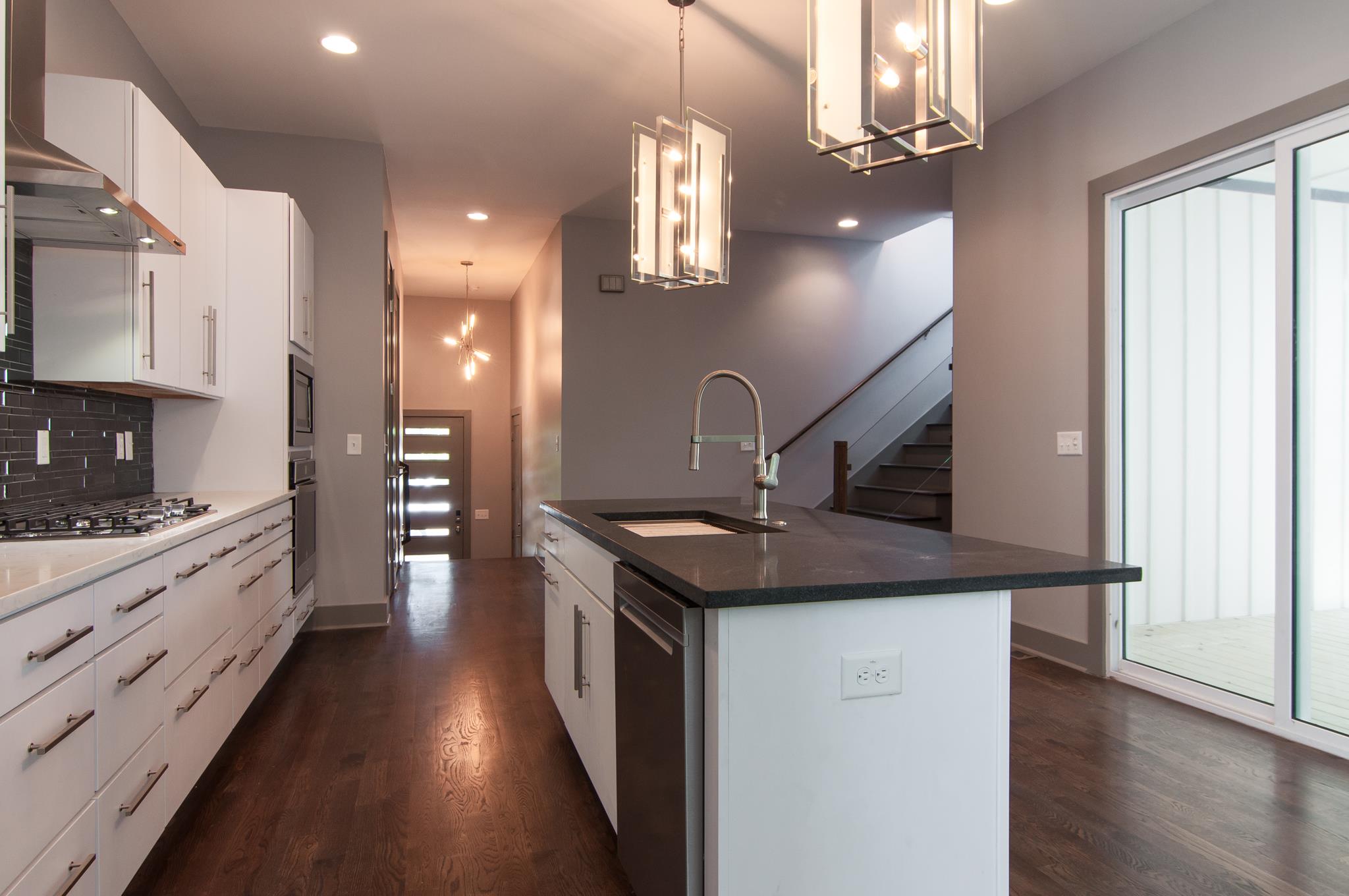 904 B Riverside Drive Nashville, TN 37206 - Photo 12 of 30 a kitchen with sink stove and refrigerator