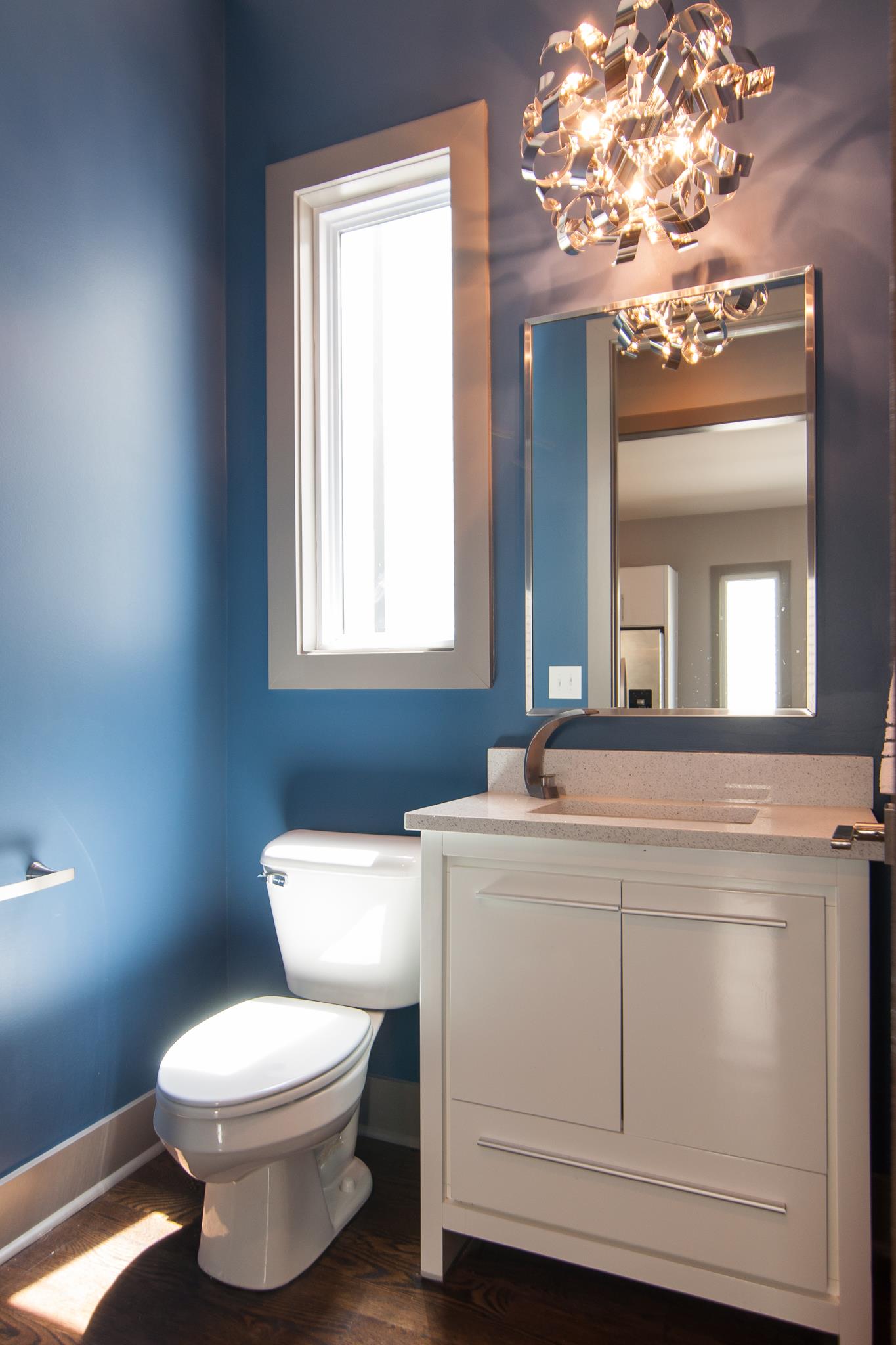 904 B Riverside Drive Nashville, TN 37206 - Photo 14 of 30 a bathroom with a toilet sink and mirror