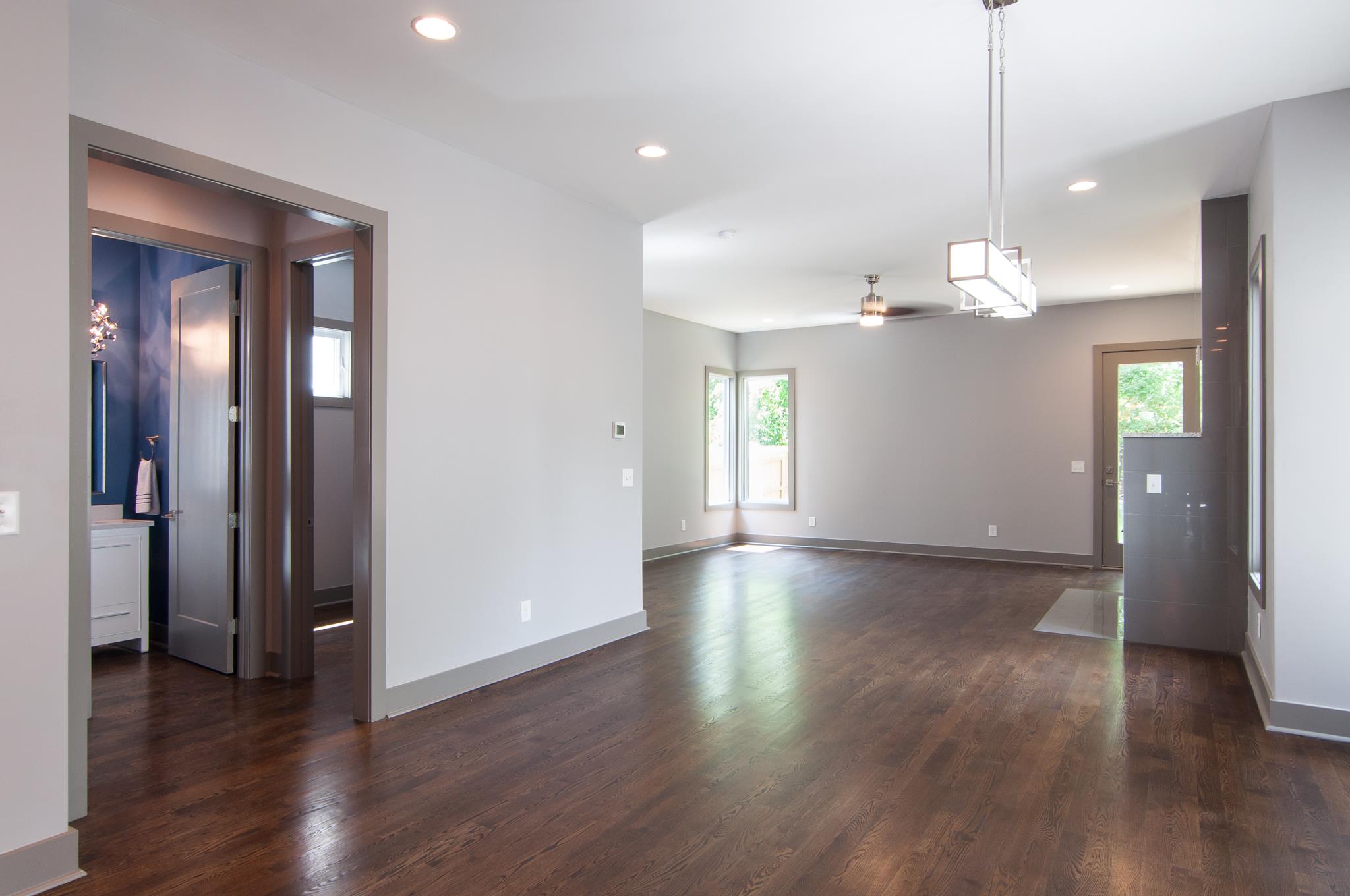 904 B Riverside Drive Nashville, TN 37206 - Photo 8 of 30 an empty room with wooden floor and mirror
