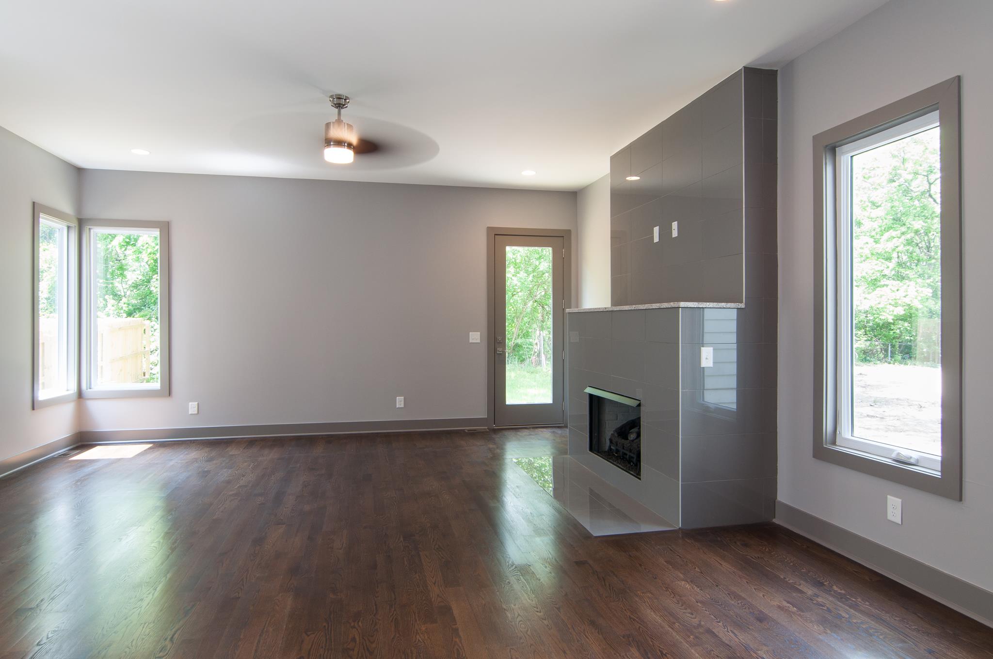 904 B Riverside Drive Nashville, TN 37206 - Photo 9 of 30 a view of a livingroom with wooden floor and a ceiling fan