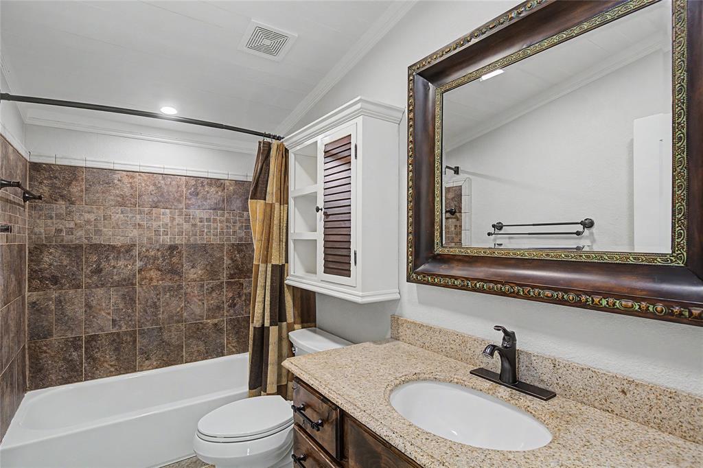 1701 Central Road Weatherford, TX 76088 - Photo 27 of 40 Full bath featuring vanity, shower / bathtub combination, plenty of storage, and ornamental mirror and molding.