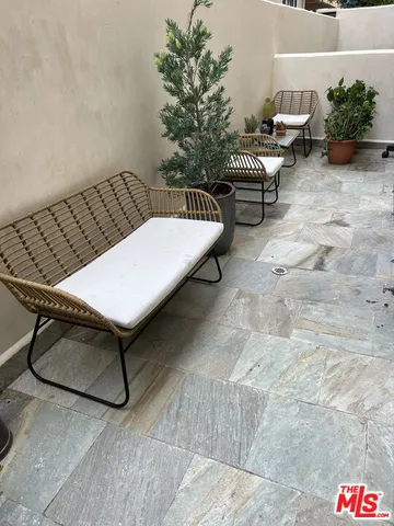a outdoor living space with furniture and a potted plant