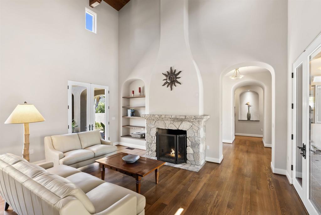 16733 Calle Hermosa San Diego, CA 92127 - Photo 12 of 43 a living room with furniture and a fireplace