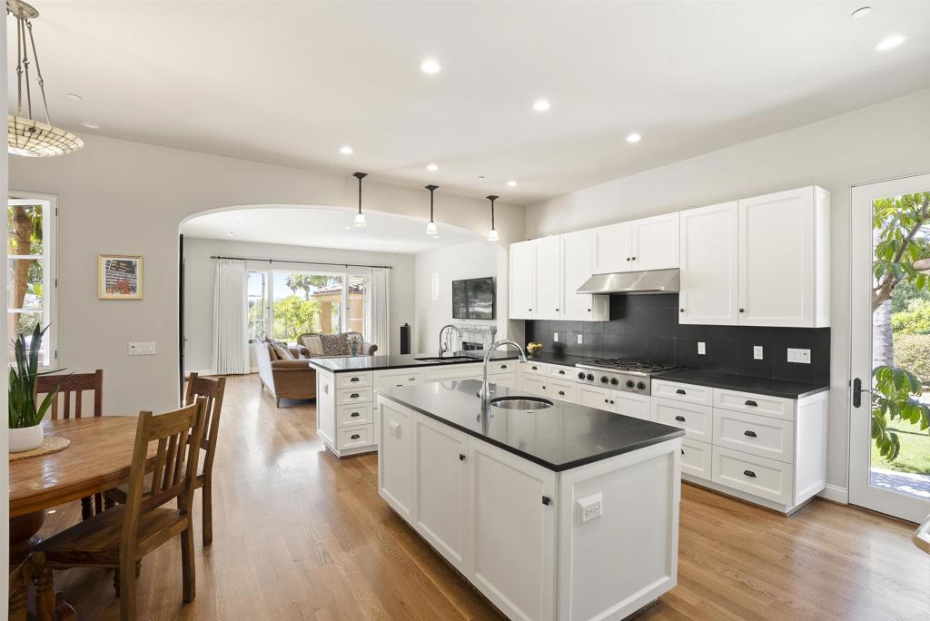 16733 Calle Hermosa San Diego, CA 92127 - Photo 14 of 43 a kitchen that has a sink a counter top space and stainless steel appliances