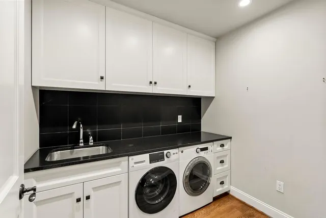 a view of cabinets and washer dryer