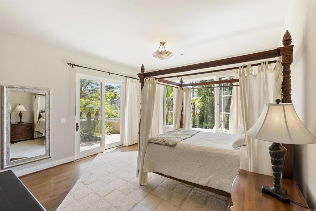 16733 Calle Hermosa San Diego, CA 92127 - Photo 23 of 43 a bedroom with a bed and large window