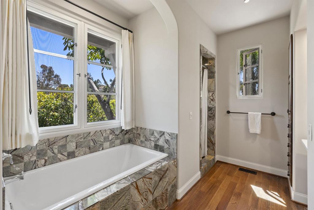 16733 Calle Hermosa San Diego, CA 92127 - Photo 27 of 43 a bathroom with a bathtub and a shower