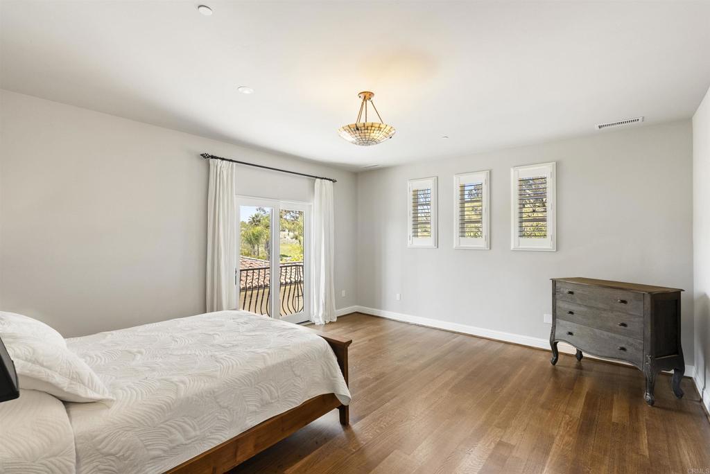16733 Calle Hermosa San Diego, CA 92127 - Photo 31 of 43 a bedroom with a bed and a window