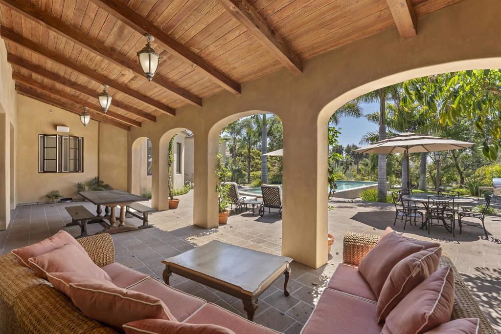 16733 Calle Hermosa San Diego, CA 92127 - Photo 34 of 43 a living room with furniture and a large window