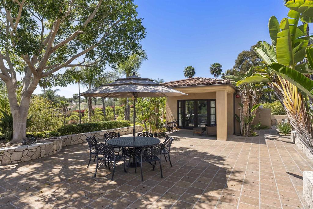 16733 Calle Hermosa San Diego, CA 92127 - Photo 39 of 43 a view of a table and chairs in the patio