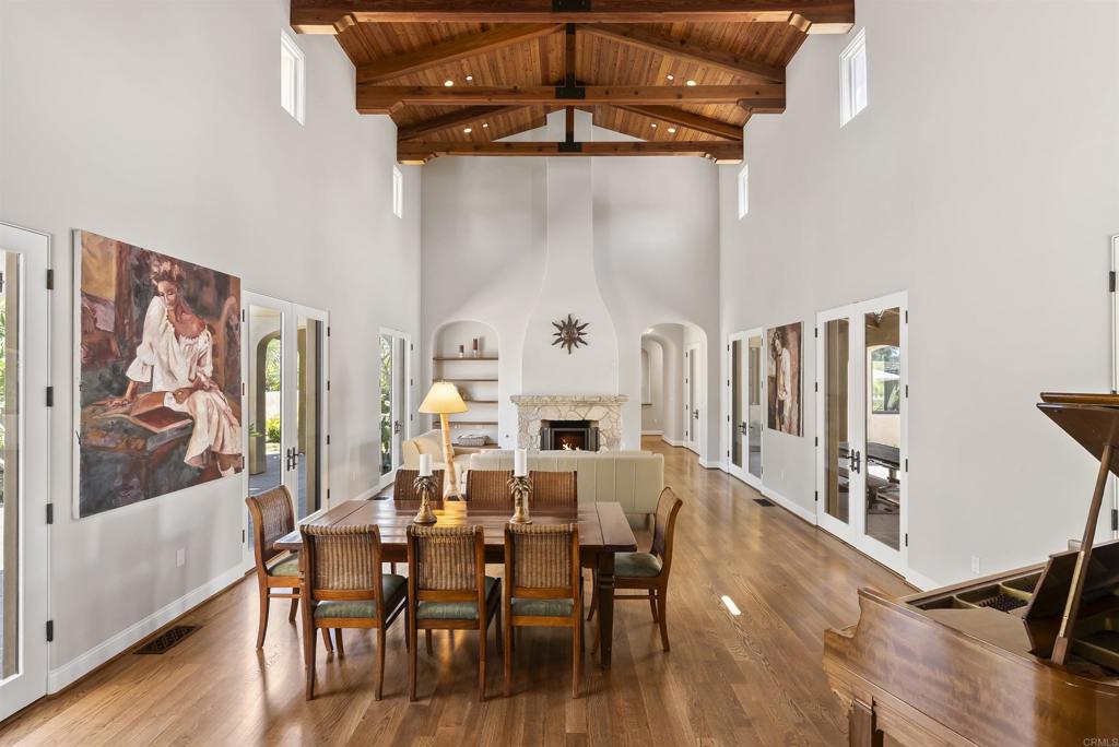 16733 Calle Hermosa San Diego, CA 92127 - Photo 10 of 43 a view of a dining room with furniture and wooden floor