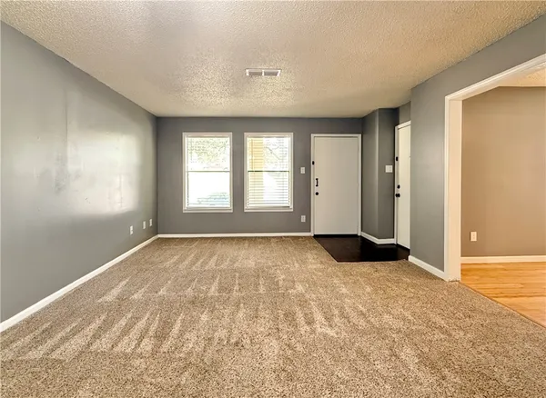 an empty room with a bathroom