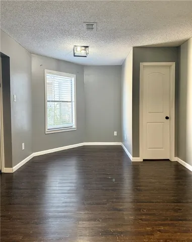 a kitchen with granite countertop cabinets stainless steel appliances and a sink