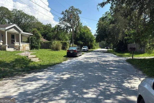 a view of a house with backyard