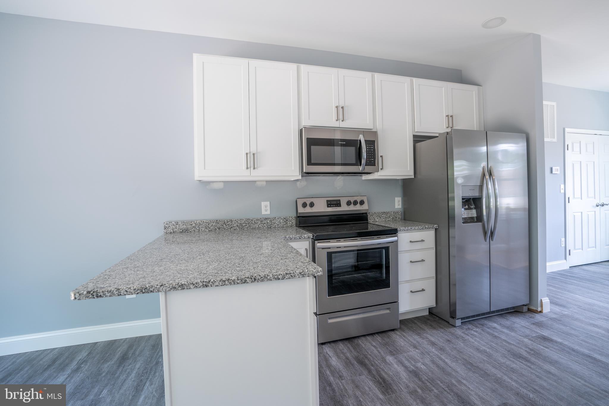 42147 St Johns Road Leonardtown, MD 20650 - Photo 14 of 39 Granite counter top with overhang for seating