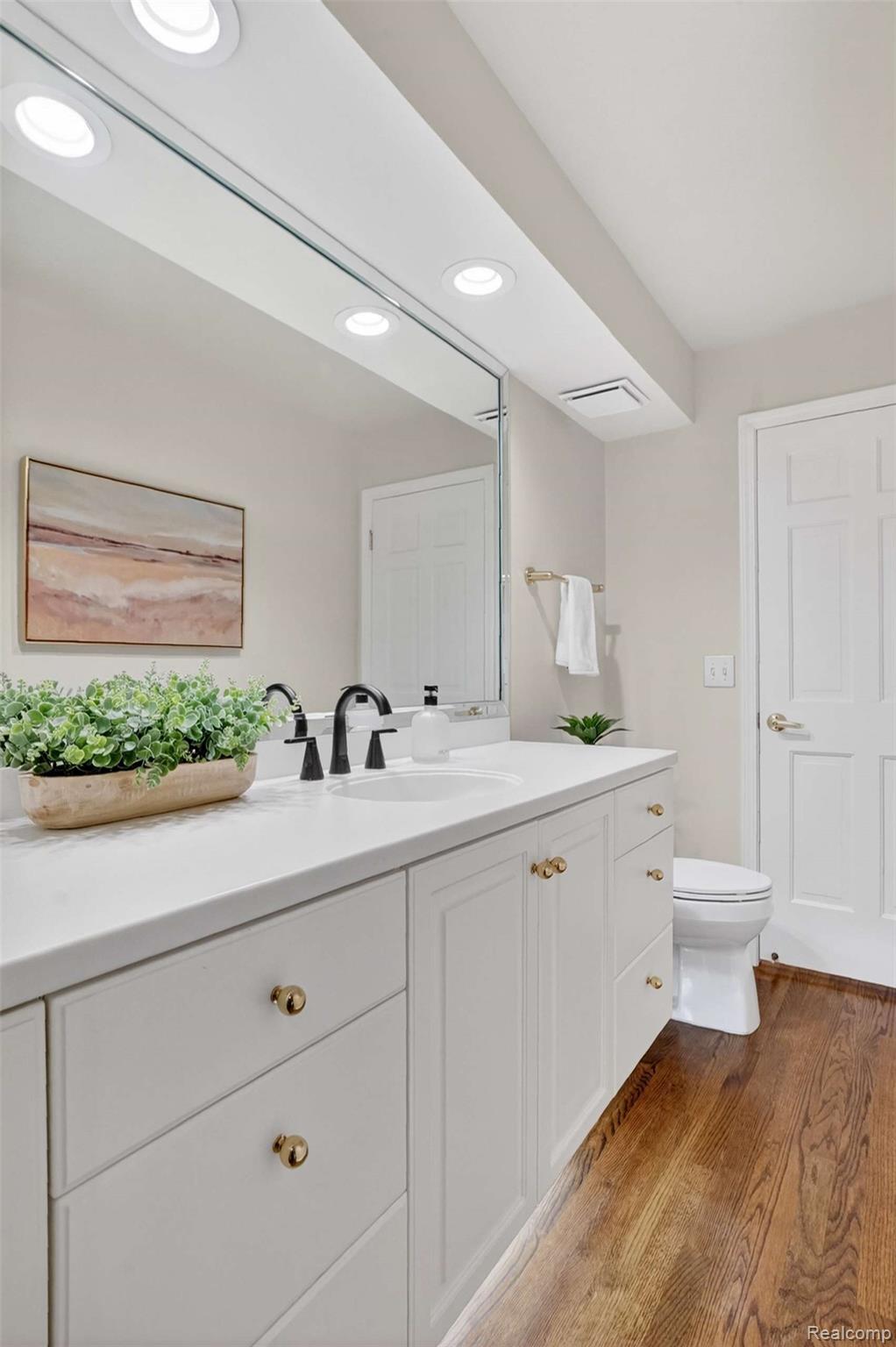 5300 Old Mill Road Rochester, MI 48306 - Photo 9 of 48 Bathroom with vanity, dark wood-type flooring, and recessed lighting