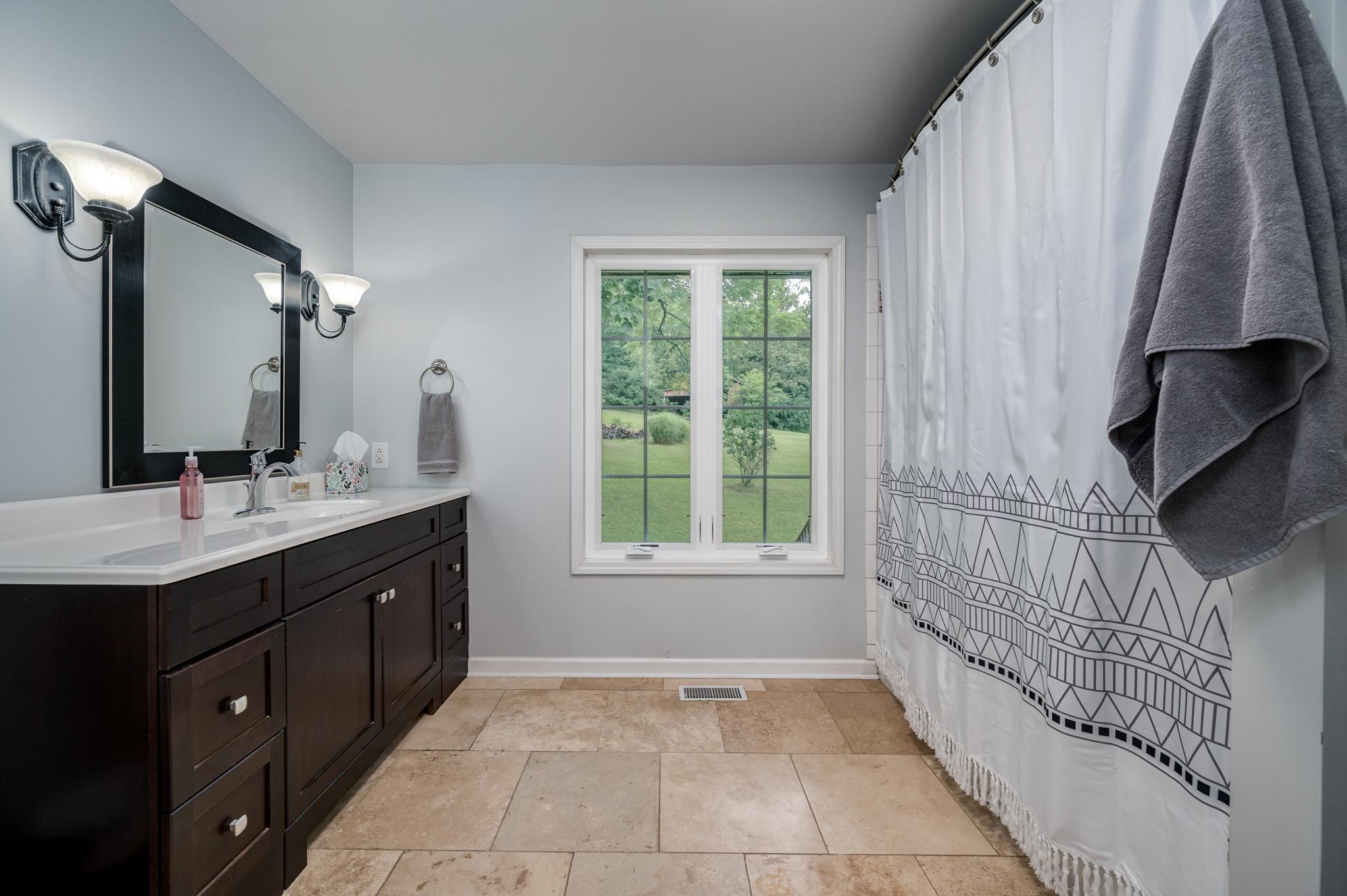 5252 Cainsville Road Lebanon, TN 37090 - Photo 19 of 45 a bathroom with a double vanity sink and a mirror