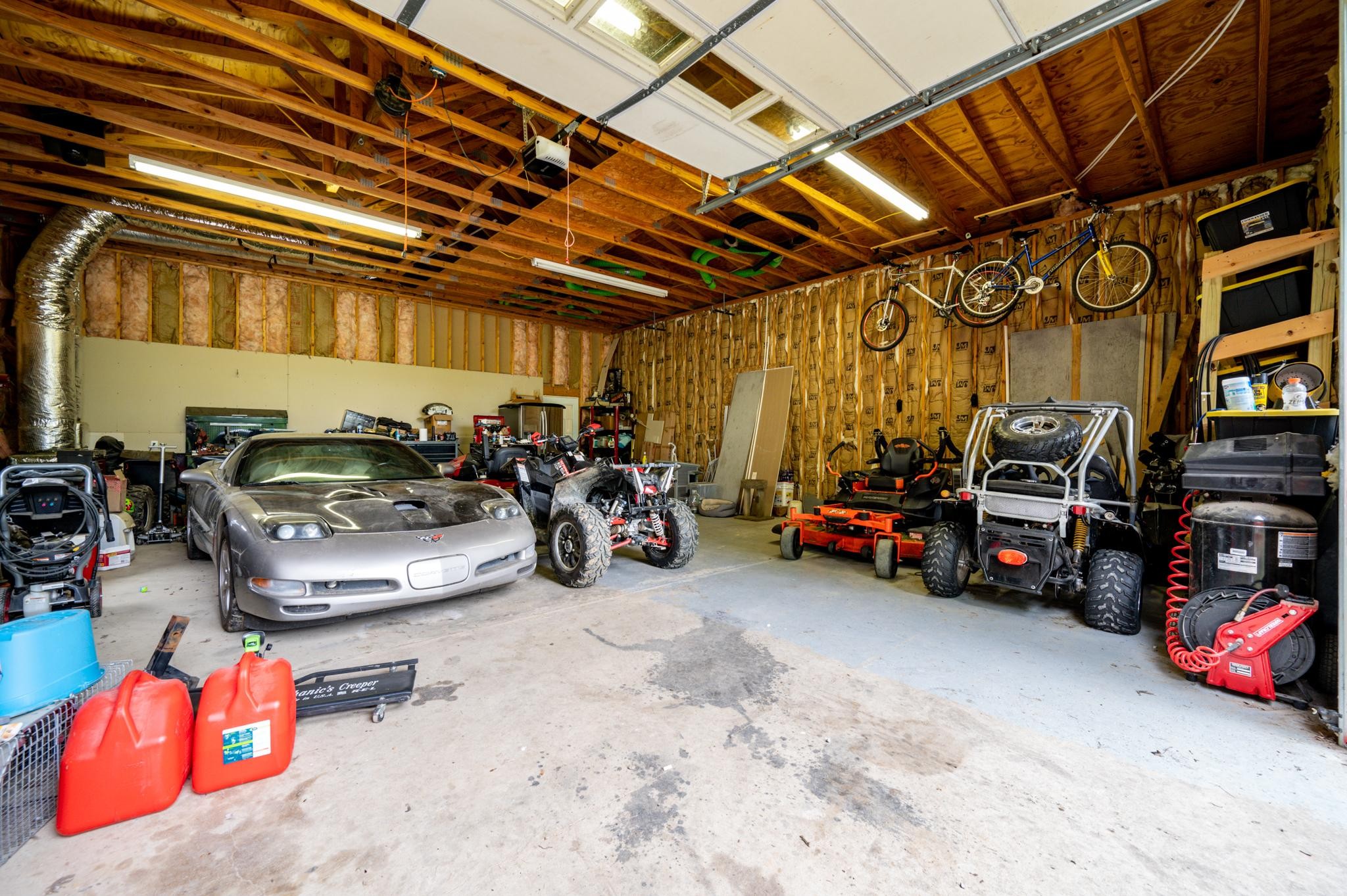 5252 Cainsville Road Lebanon, TN 37090 - Photo 29 of 45 a bedroom with a bed and a chandelier