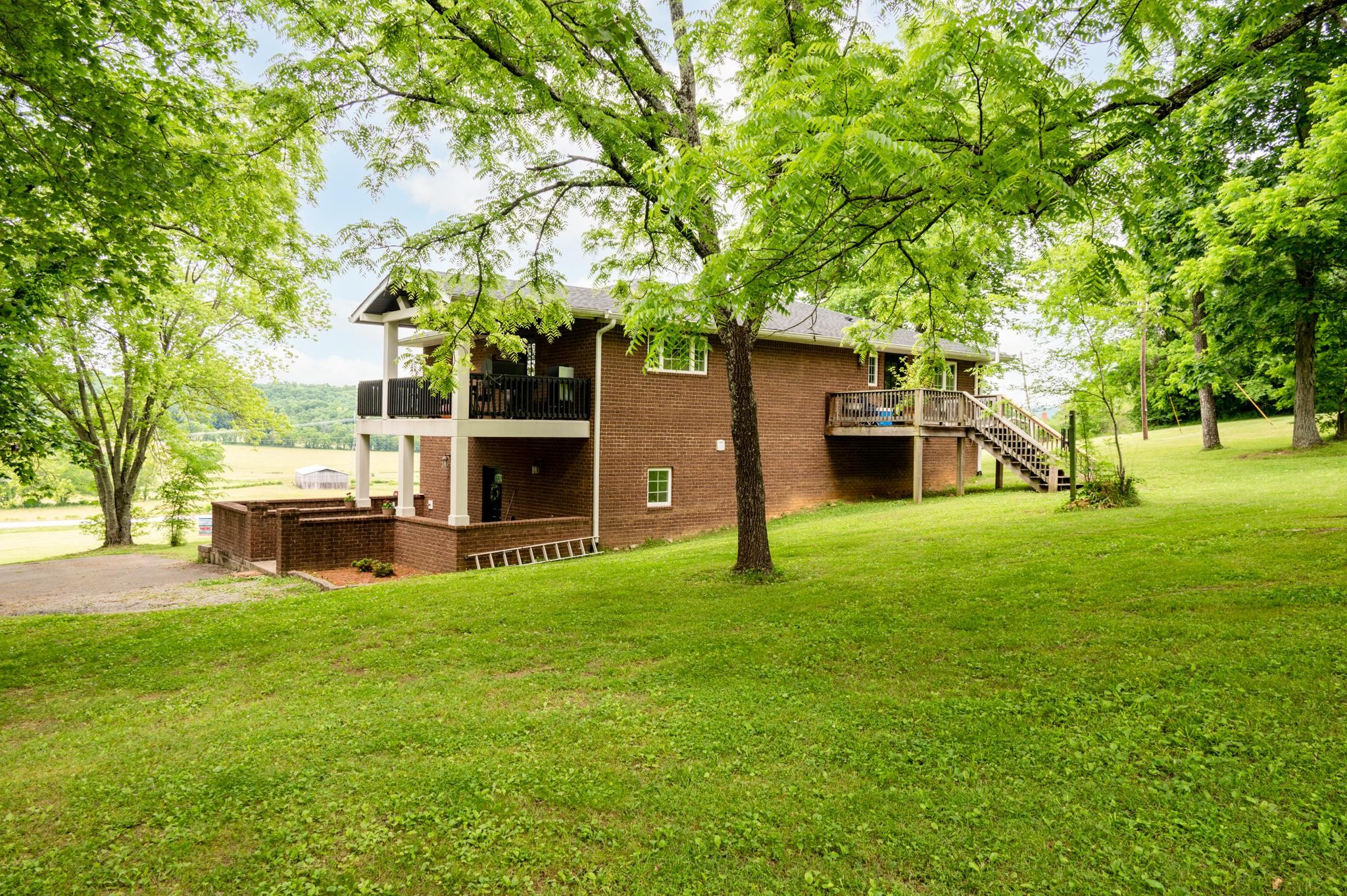 5252 Cainsville Road Lebanon, TN 37090 - Photo 4 of 45 a house view with a sitting space and garden