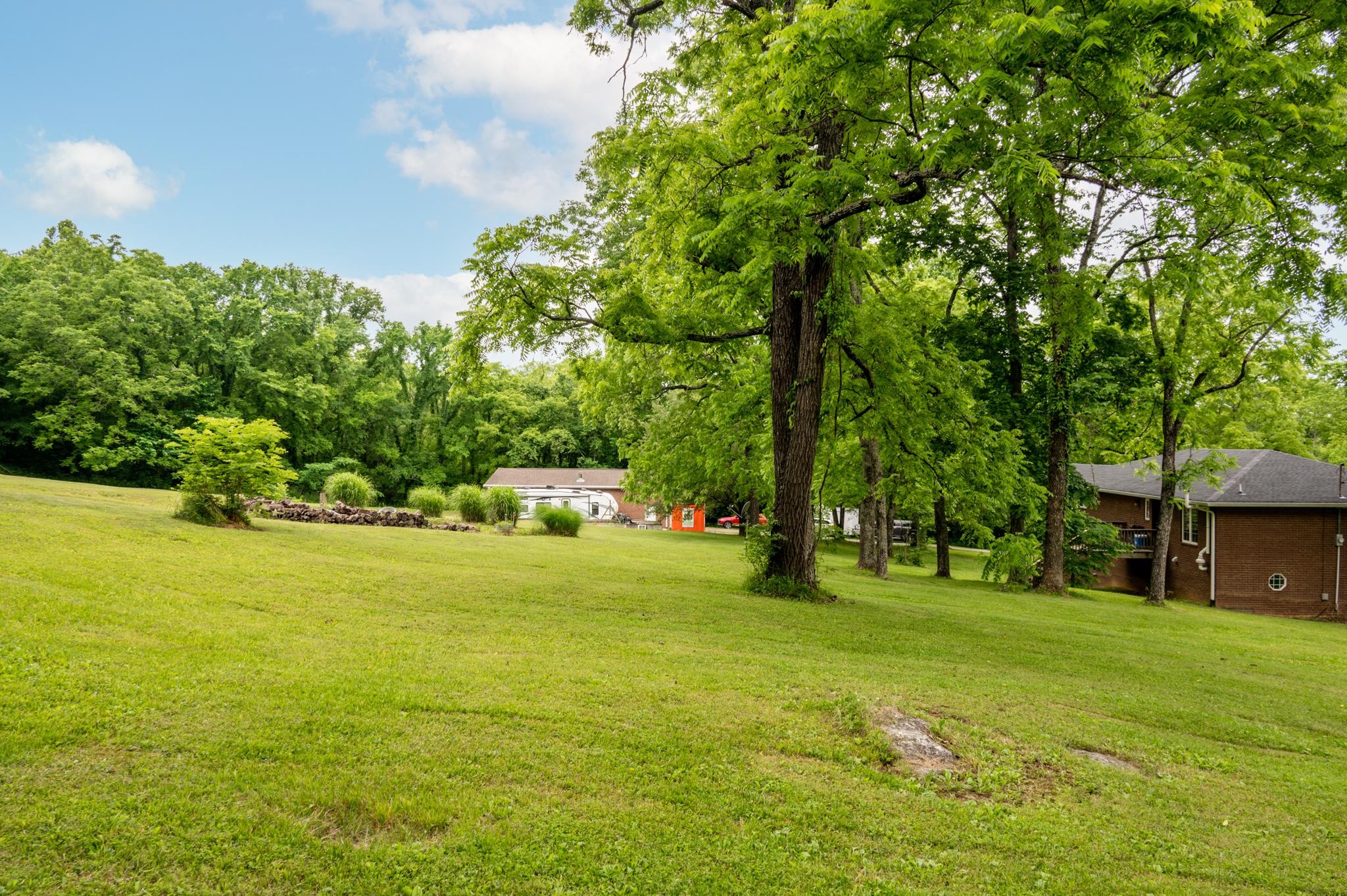 5252 Cainsville Road Lebanon, TN 37090 - Photo 32 of 45 a swimming pool with trees in the background