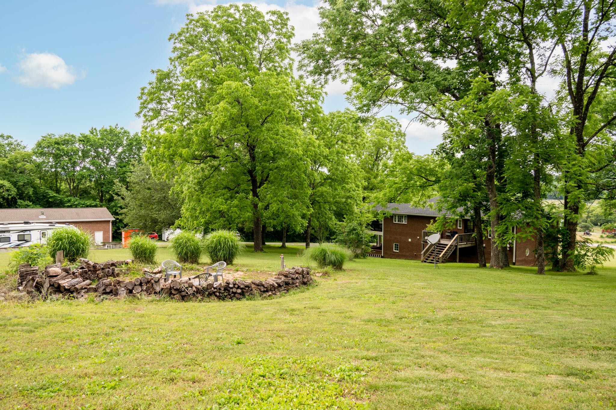 5252 Cainsville Road Lebanon, TN 37090 - Photo 33 of 45 a view of a swimming pool and trees in the background