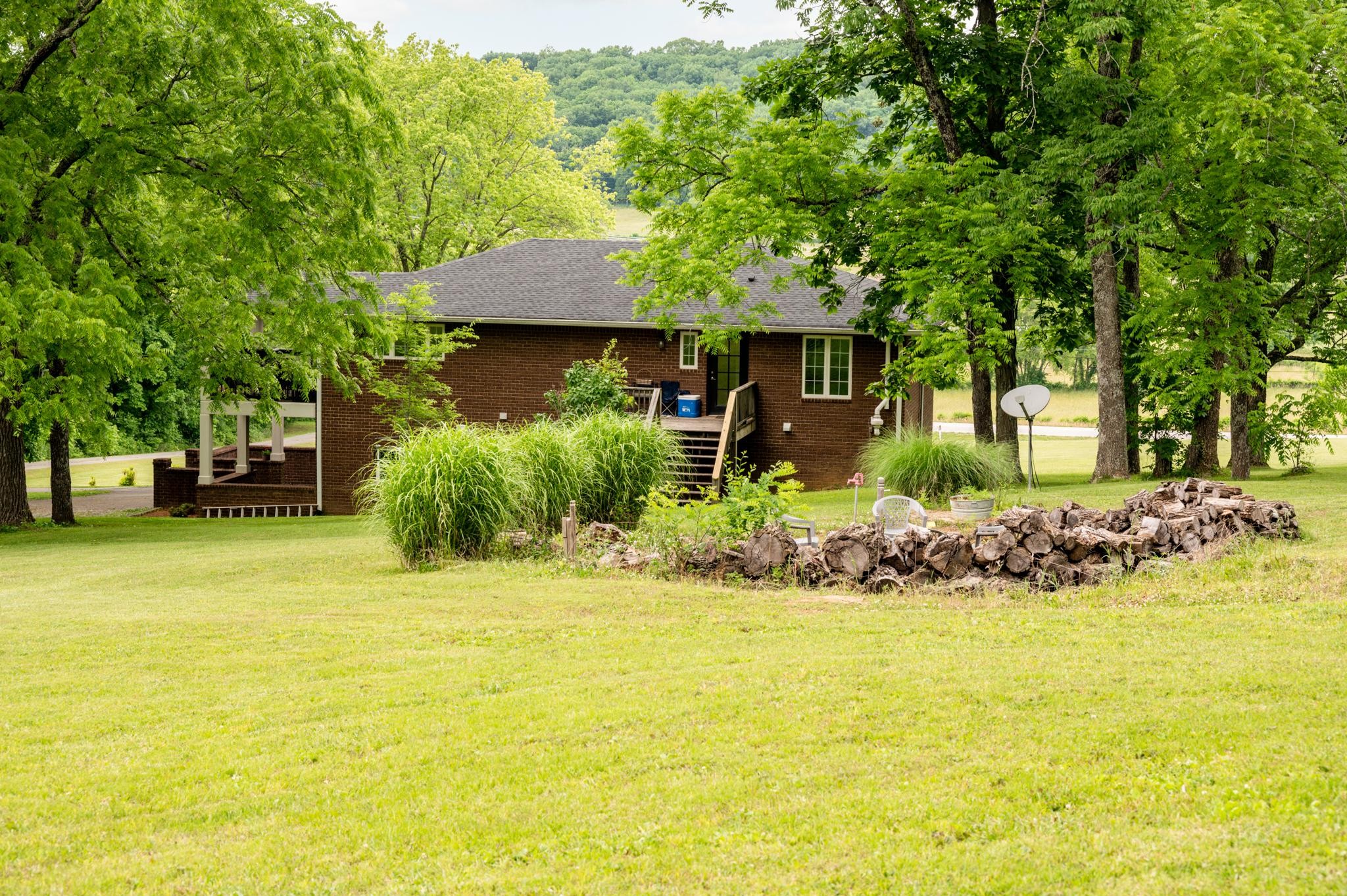 5252 Cainsville Road Lebanon, TN 37090 - Photo 35 of 45 a front view of a house with a garden