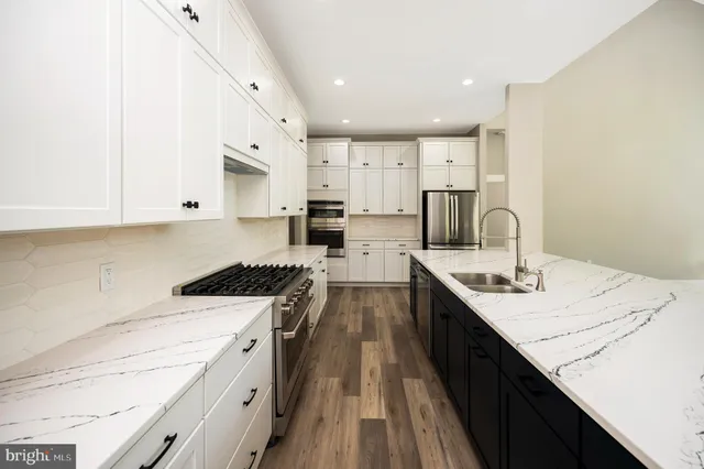 a kitchen with granite countertop a sink and a window