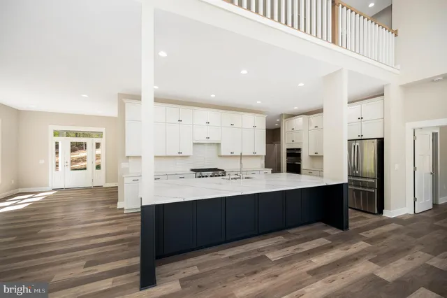 a bathroom with double vanity sinks and a mirror
