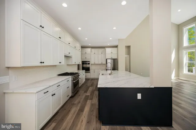 a white bath tub sitting next to a shower