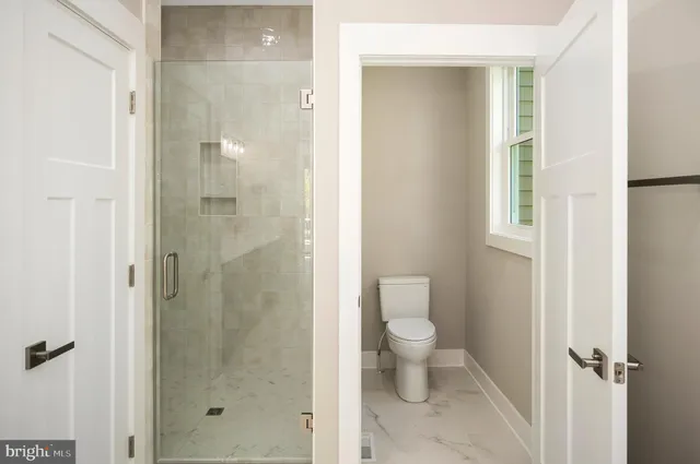 a view of a patio with wooden floor next to a yard