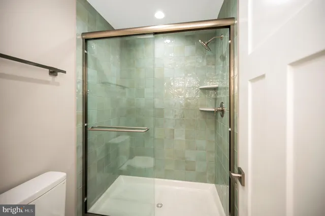 a view of a house with a big yard and large trees