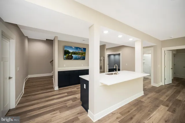 a view of a balcony with wooden floor and fence