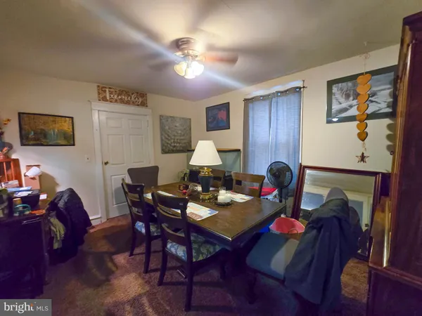 a work room with furniture and wooden floor