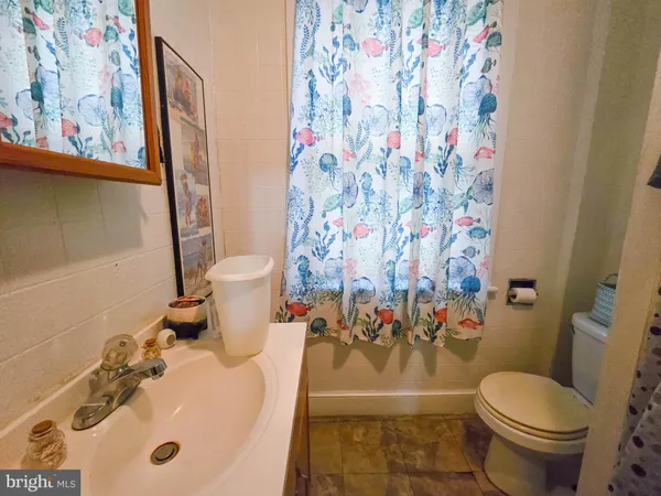 a bathroom with a toilet and a sink