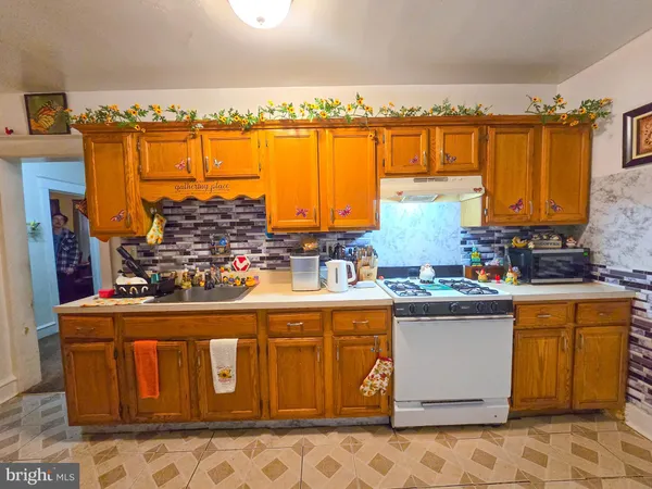 a refrigerator freezer sitting inside of a kitchen