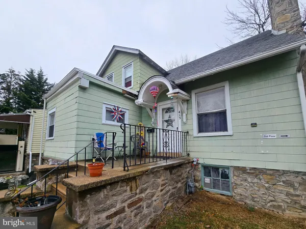 a front view of house with outdoor seating