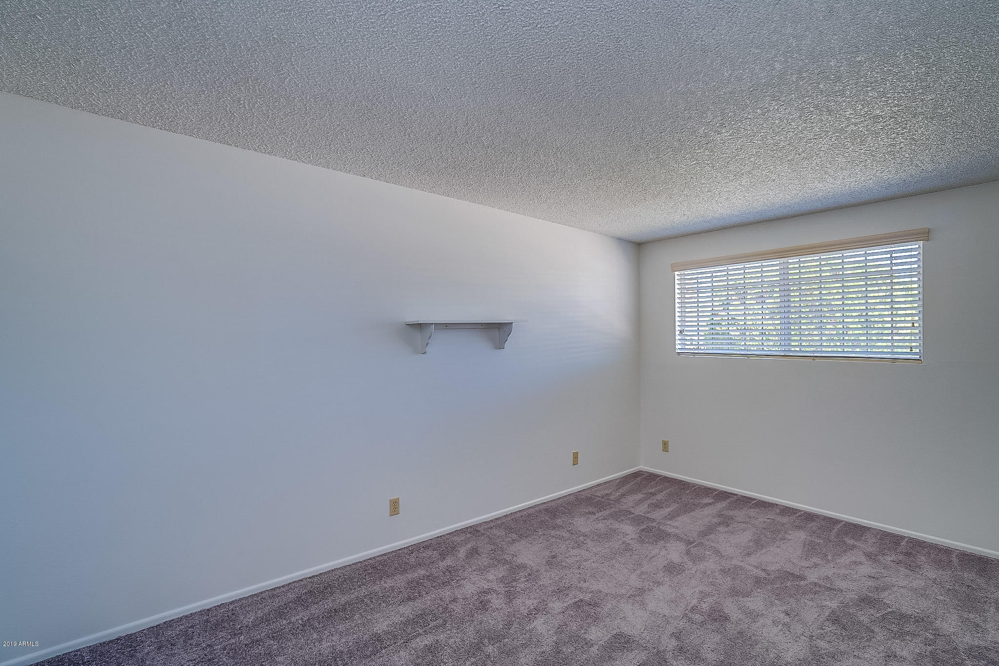 3601 West Griswold Road Phoenix, AZ 85051 - Photo 24 of 40 an empty room with a window