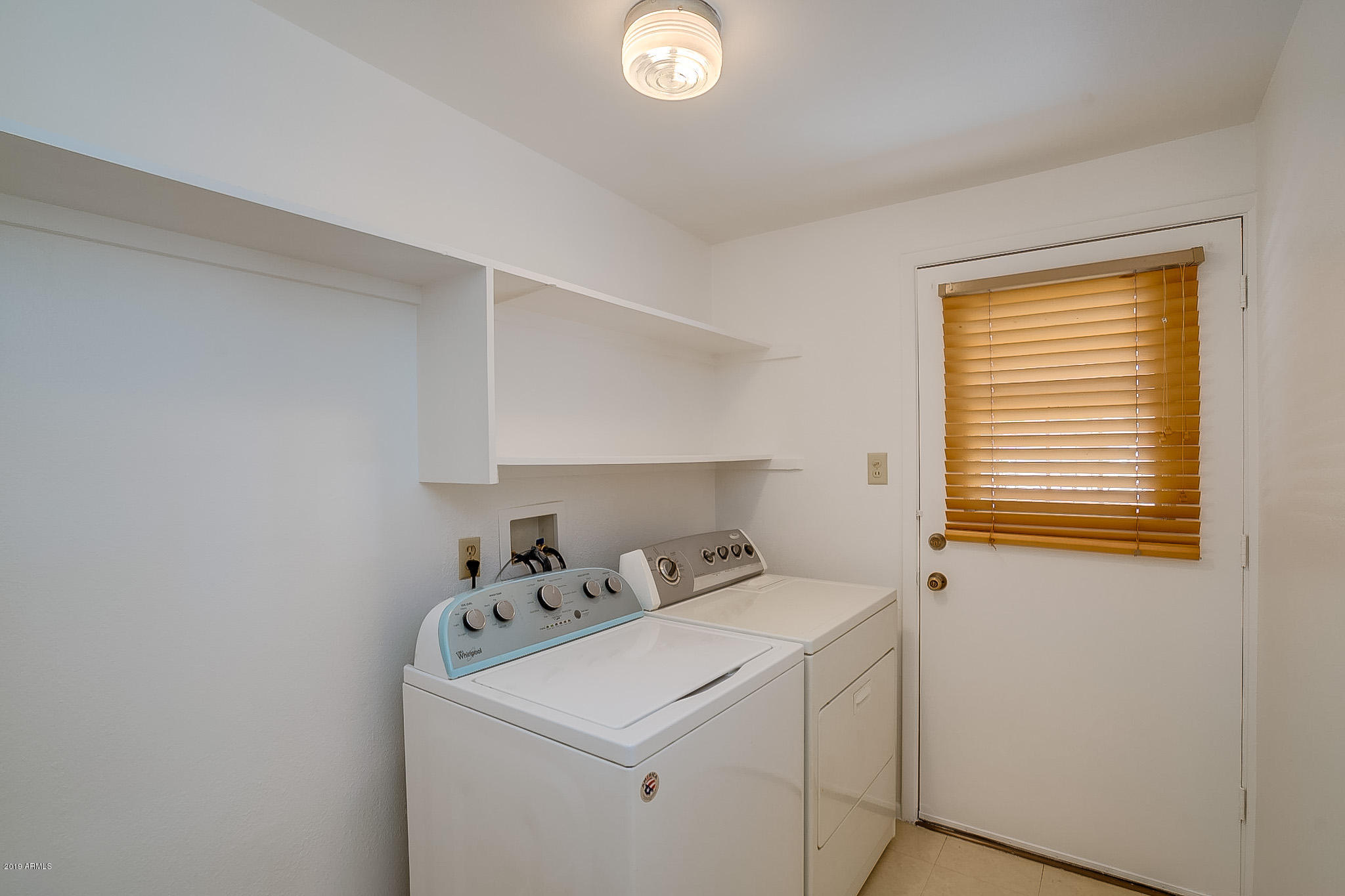 3601 West Griswold Road Phoenix, AZ 85051 - Photo 35 of 40 a utility room with dryer and washer