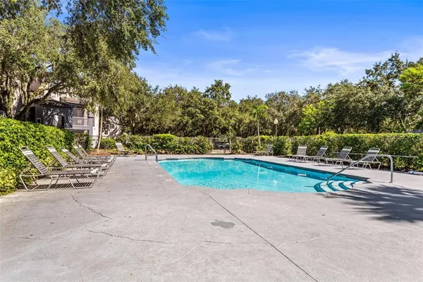 a living room with furniture a fireplace and a table