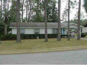 21332 Southwest Sw Dunnellon, FL 34432 - Photo 1 of 1 a backyard of apartments with large trees