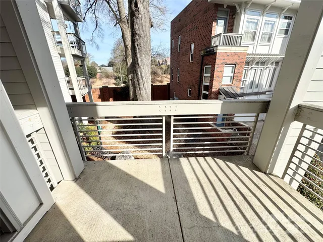 a view of balcony and wooden floor