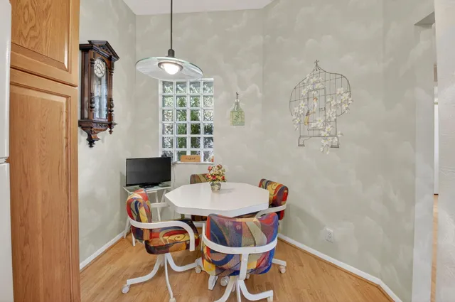 a dining room with furniture and window