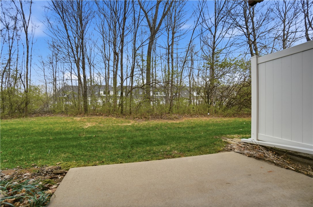 4294 Straight Arrow Road Dayton, OH 45430 - Photo 37 of 41 This serene outdoor space offers a private retreat with lush greenery and a sturdy fence.