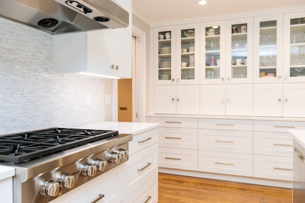 134 Edmunds Road Wellesley, MA 02481 - Photo 10 of 29 a stove top oven sitting inside of a kitchen