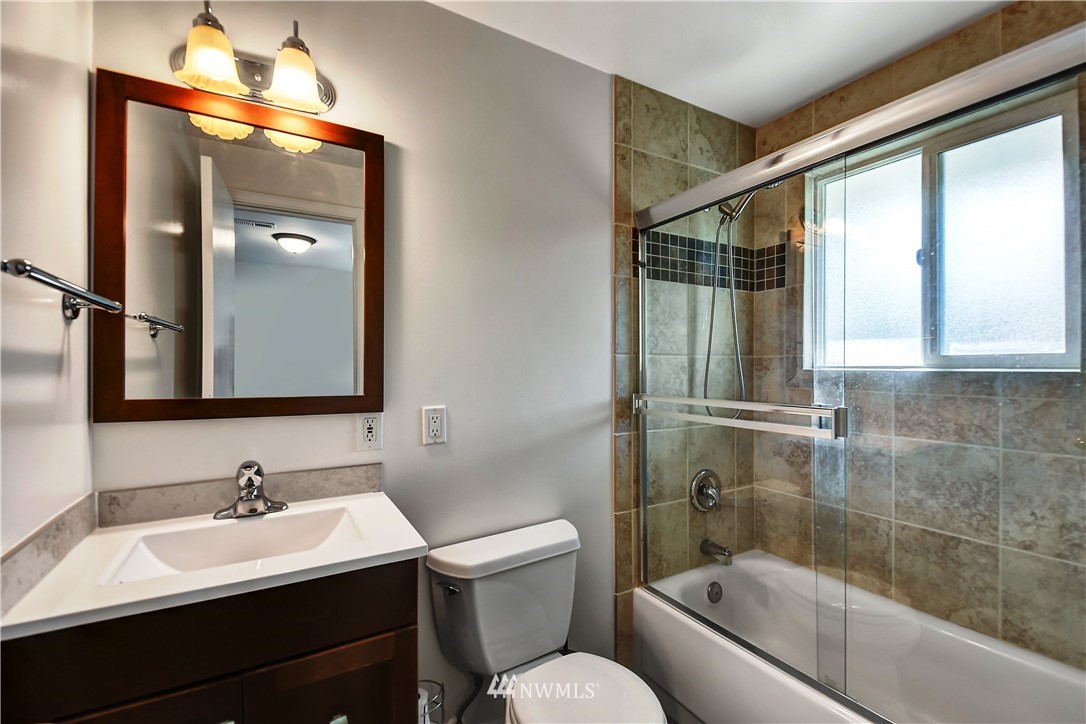 22119 Meridian Avenue South Bothell, WA 98021 - Photo 14 of 17 a bathroom with a sink toilet and shower